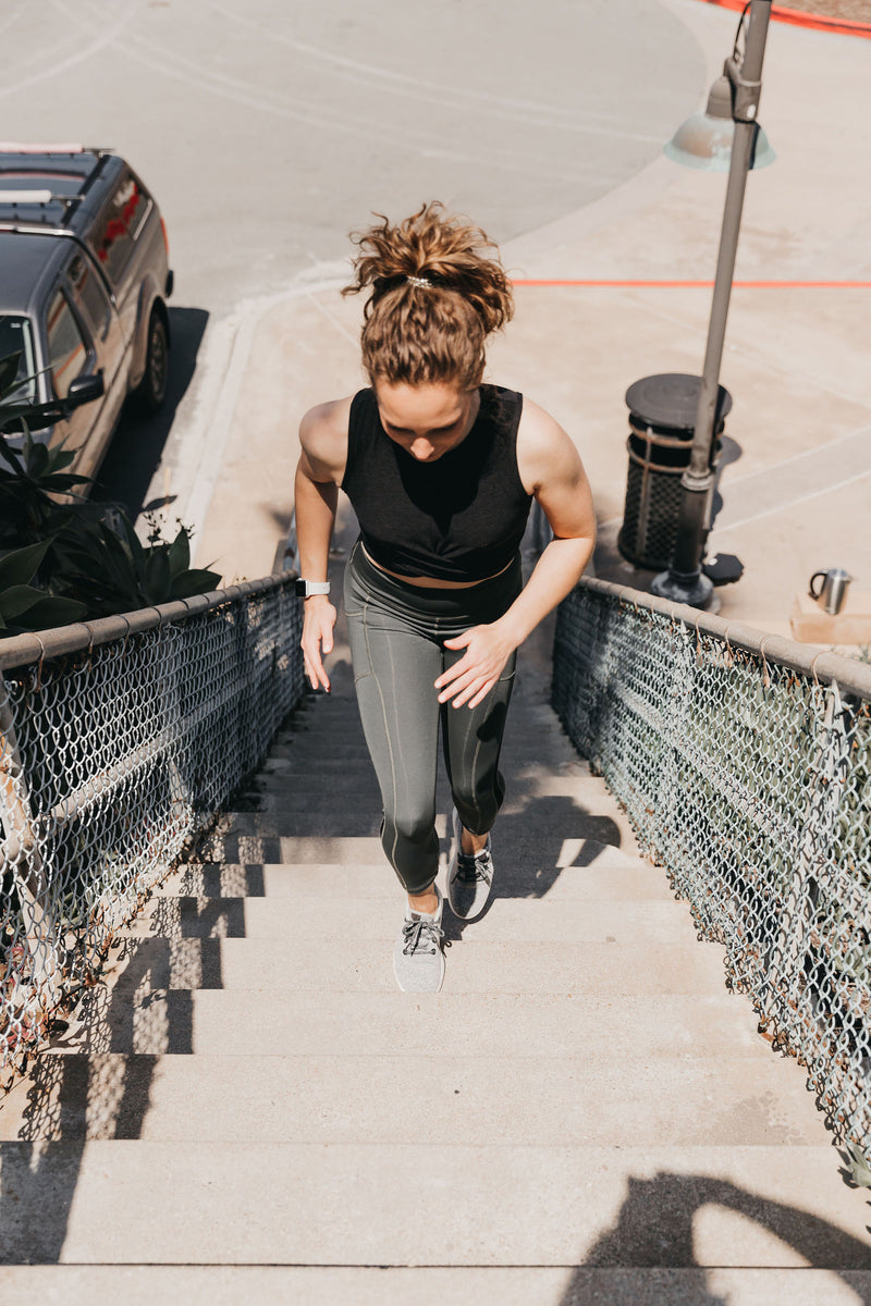 Woman running up the stairs