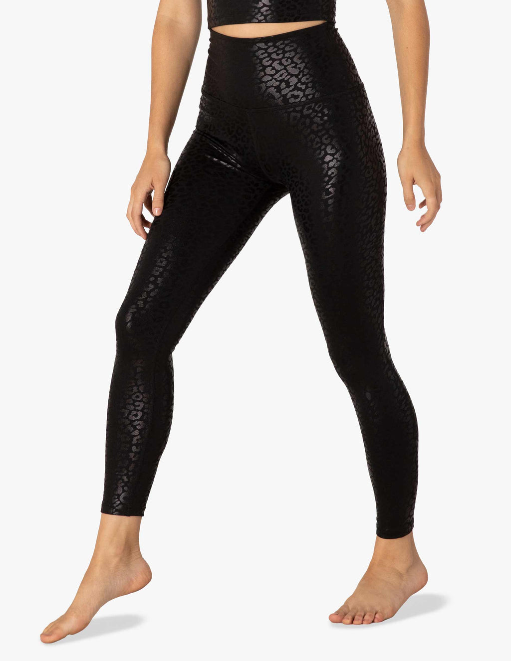 Side look at the Beyond Yoga Shiny Leopard High Waisted Midi Legging