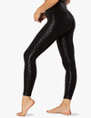 Back view of the Beyond Yoga Shiny Leopard High Waisted Midi Legging