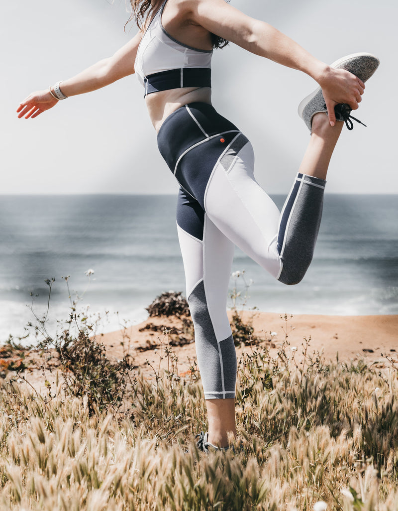 Woman doing a yoga pose in the VIMMIA Perception Crop
