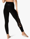 Additional side view of the Beyond Yoga So Slashed High Waisted Midi Legging