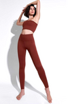 Overall view of the Avocado Mid Rise Phoenix Fire Legging  in Rust