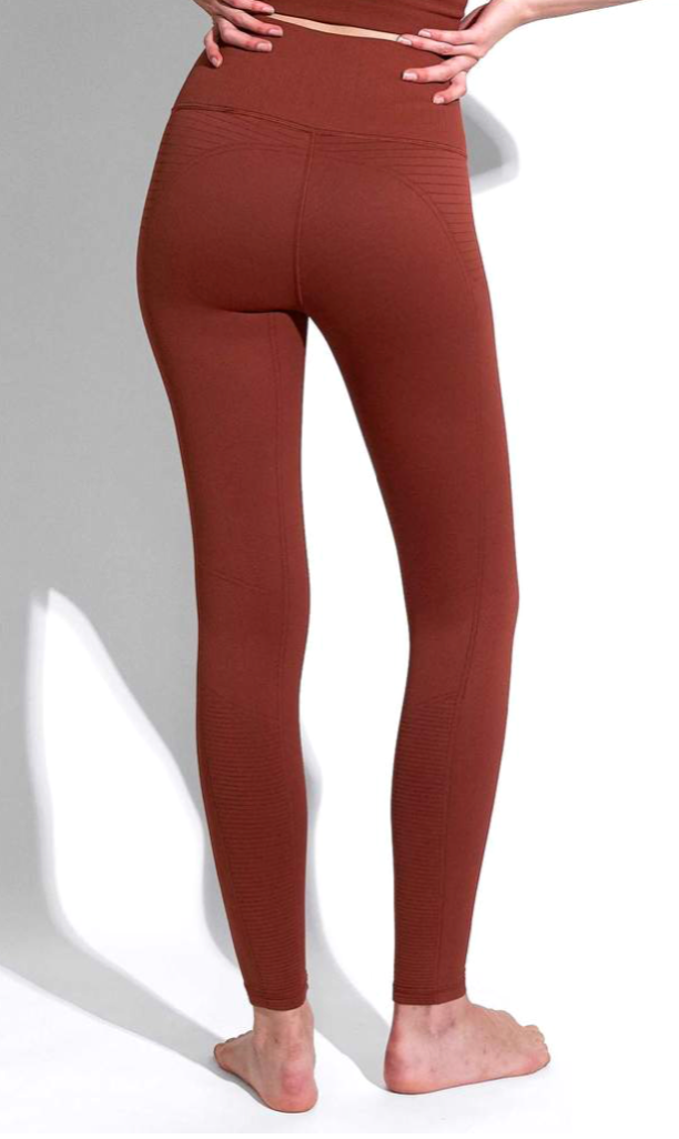Back view of the Avocado Mid Rise Phoenix Fire Legging in Rust
