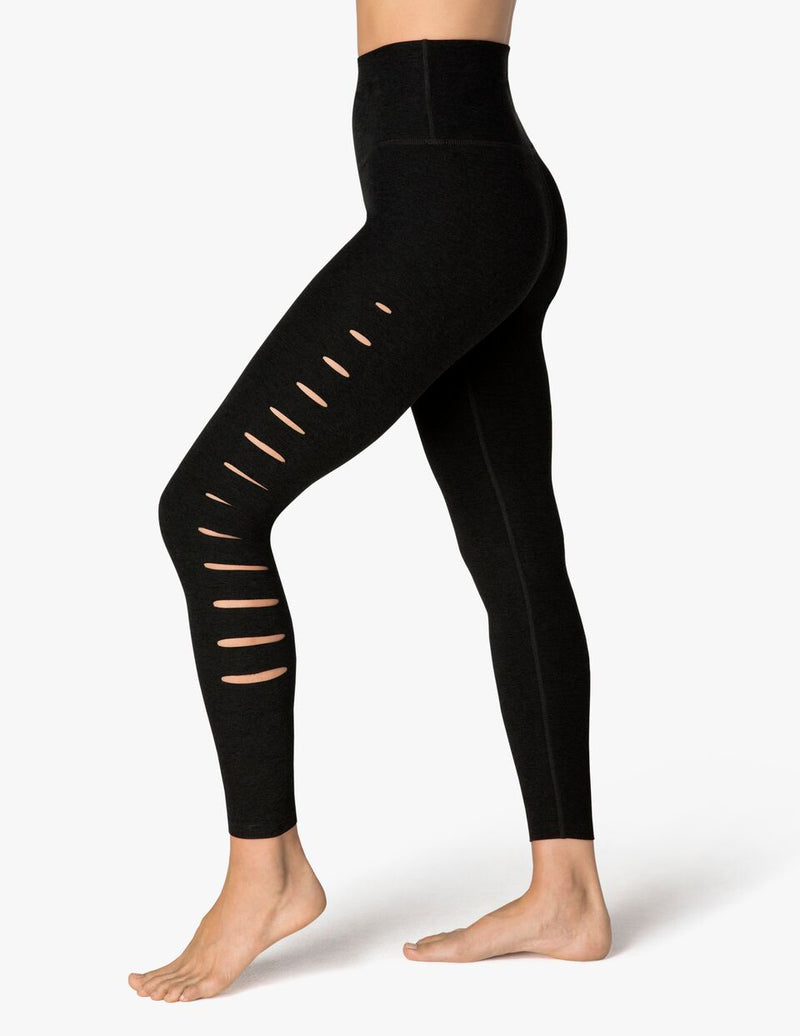 Side view of the Beyond Yoga So Slashed High Waisted Midi Legging